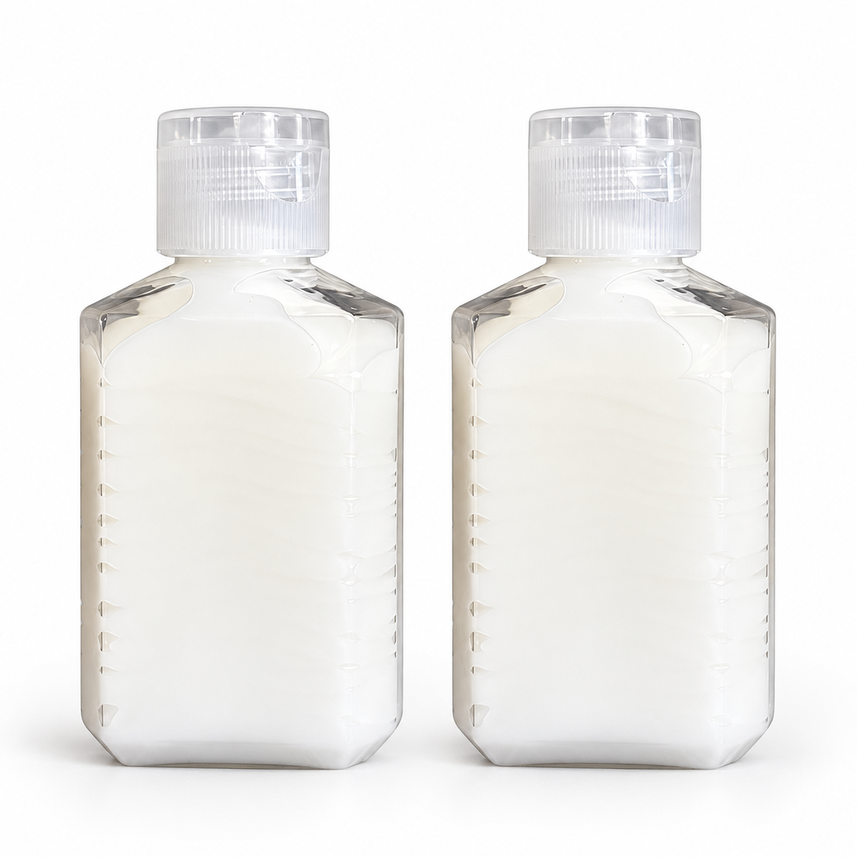 Two clear temporary containers filled with cream, with clear flip-top caps